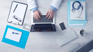 Doctor's desk with computer and stethoscope